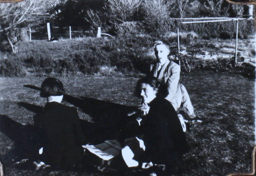 NEUC students sitting on the lawn
