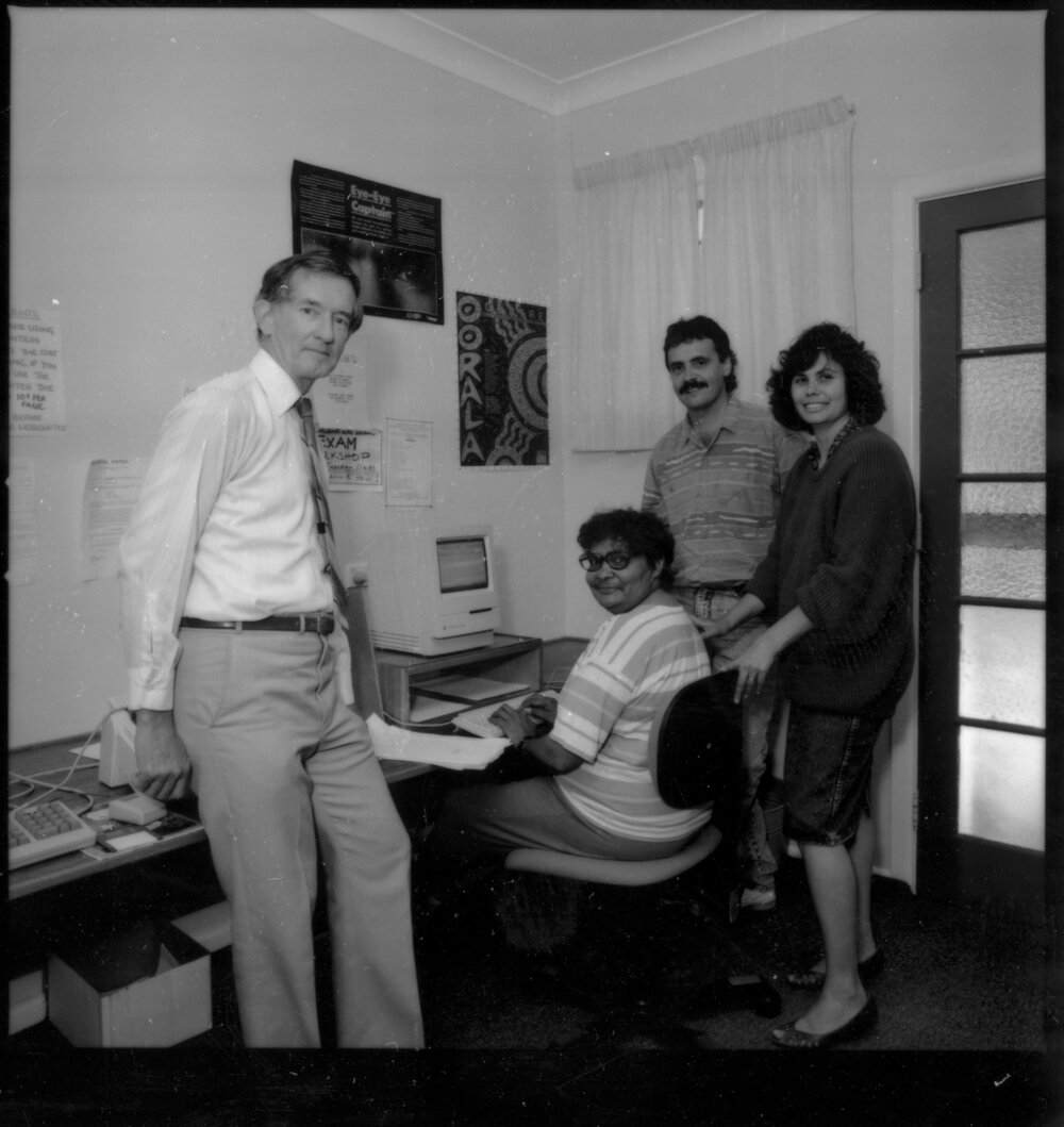 Oorala staff at a computer