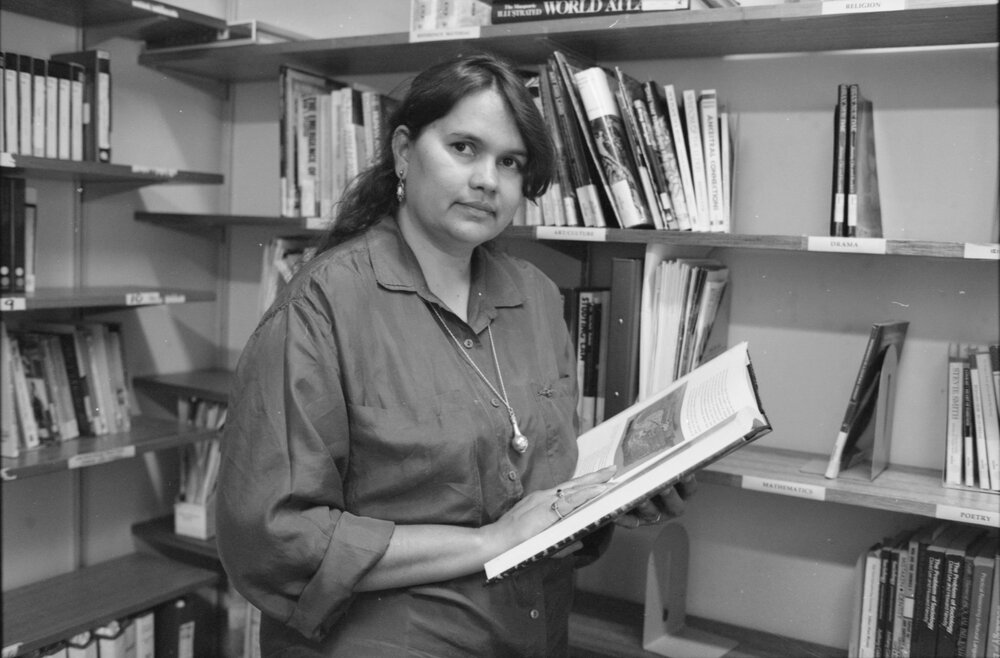 [TRACKS student] in the library, 1995