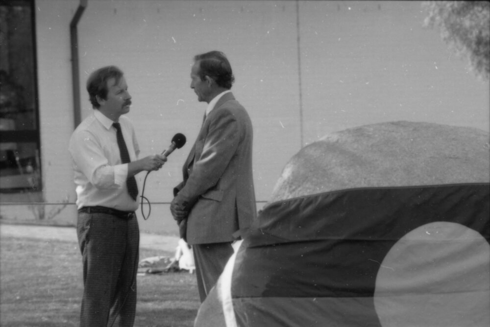 Dr Robertson-Cuninghame (Chancellor, UNE) interviewed by L. Danieli before Aboriginal Rock commemoration ceremony, 1988