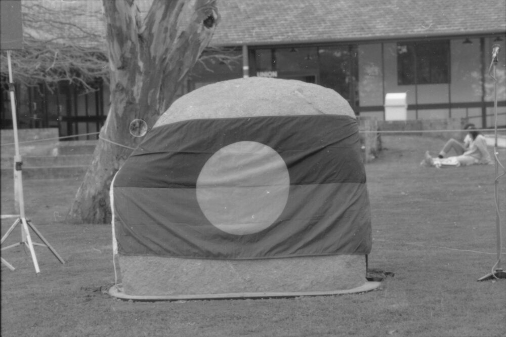 'Aboriginal Rock' draped in the Aboriginal Flag at the ceremony for Aboriginal Education, 1988