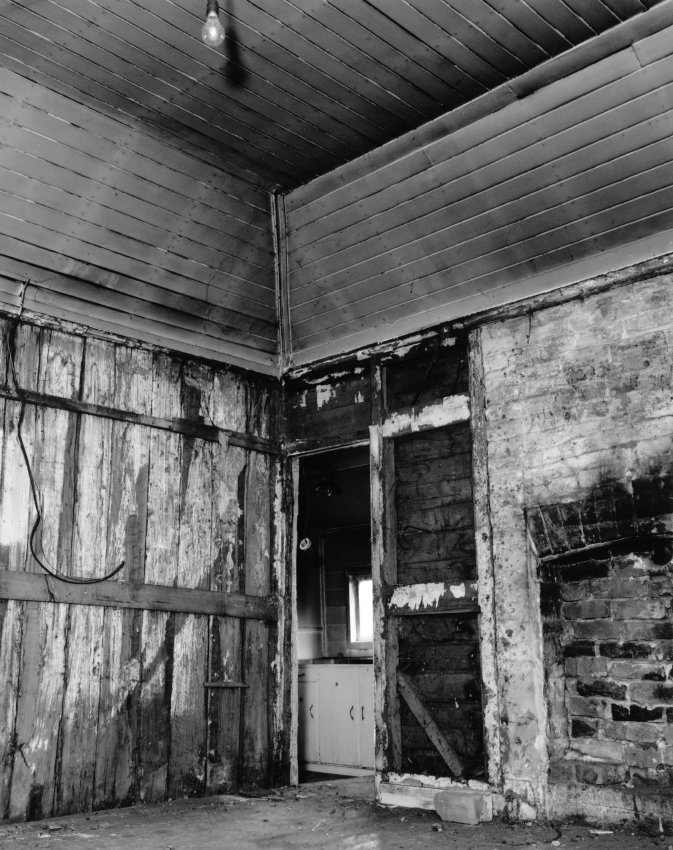 Interior view of a house in Markham Street before renovations
