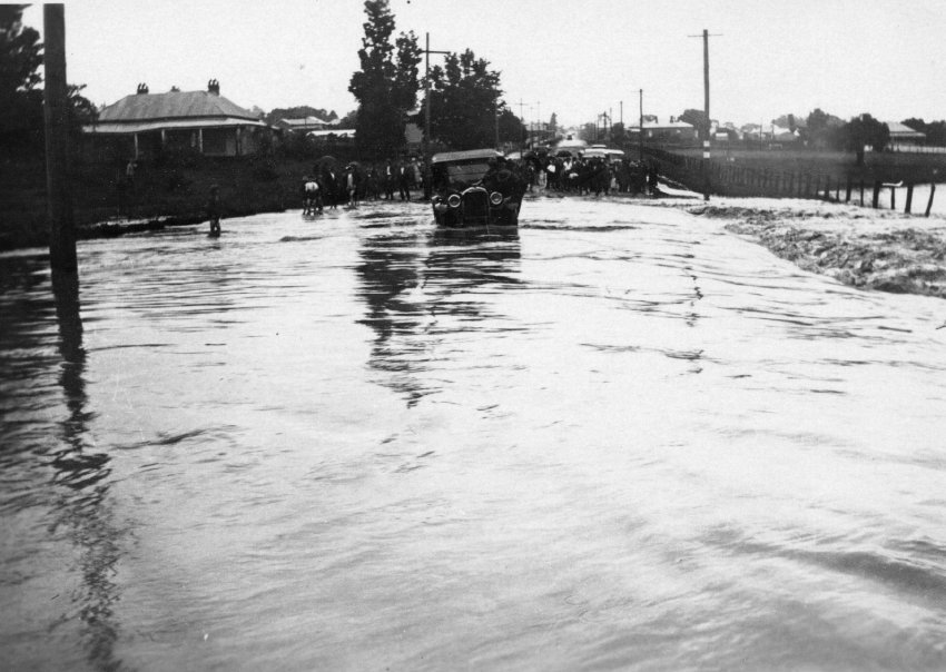 Flood across street at northern end of new bridge in Marsh Street, looking towards North Armidale, 19 February 1928
