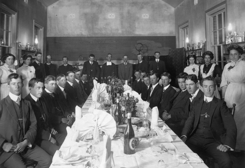 Students of De La Salle Boys' College at a formal dinner held in the Science Room 