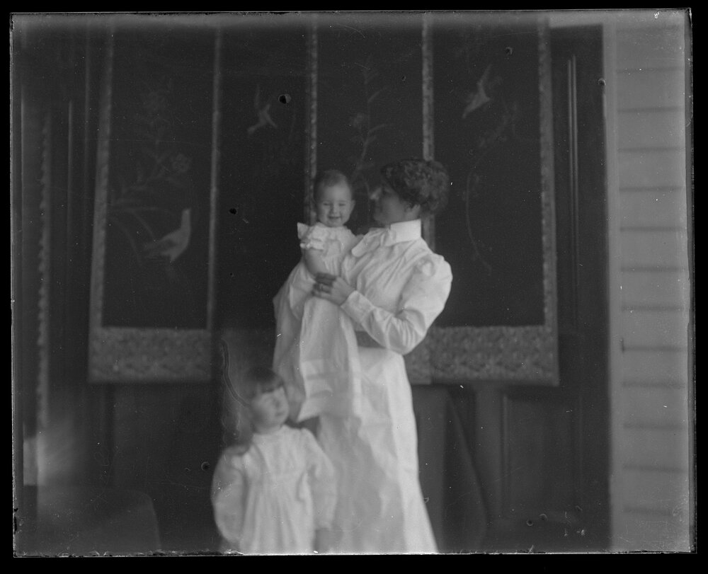 Woman with child and baby