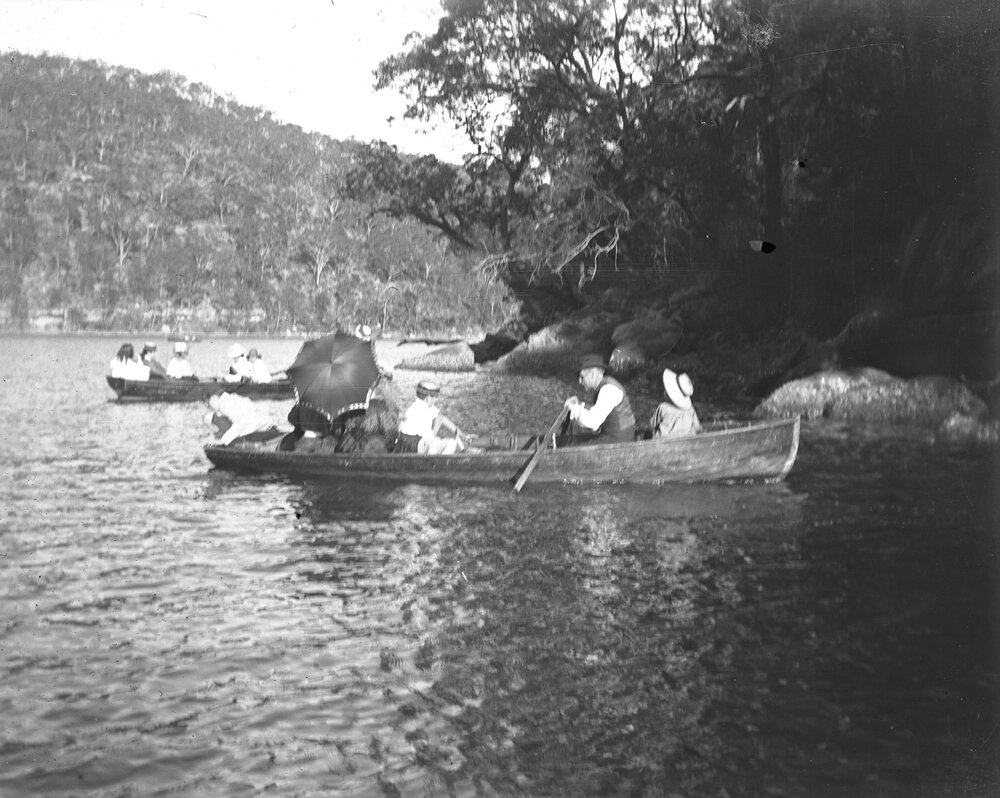 People in canoes on a lake