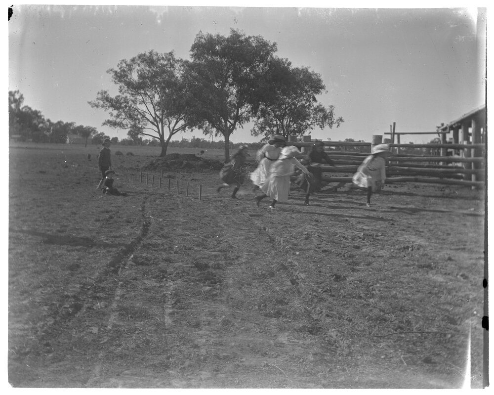 Children playing in a paddock