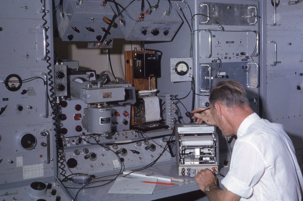 Man using scientific instrumentation for radio research, UNE