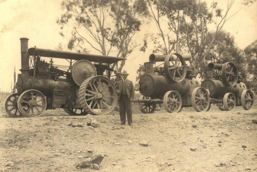 Traction engine hauling two portable engines, driver Mr. T.C. Faint, Hillgrove, NSW