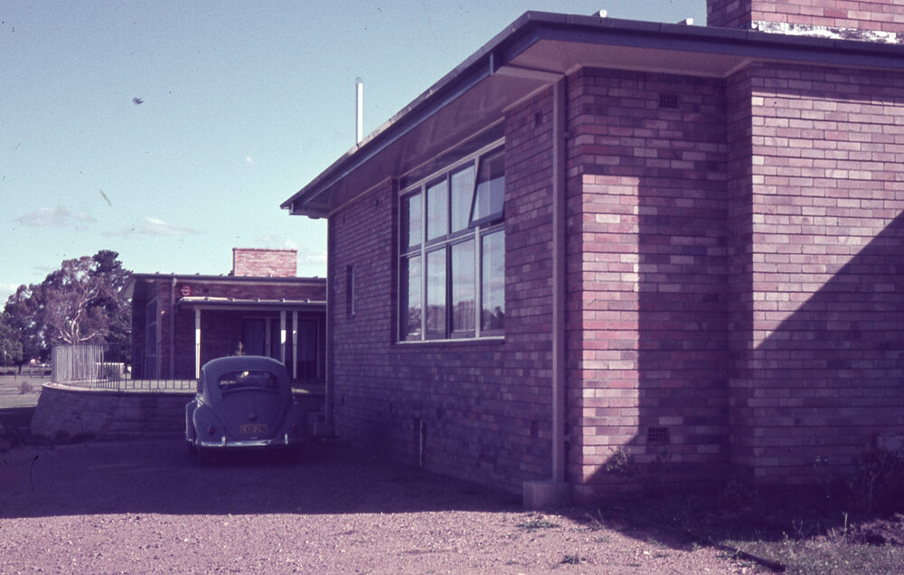External view of Wright College with a car, UNE