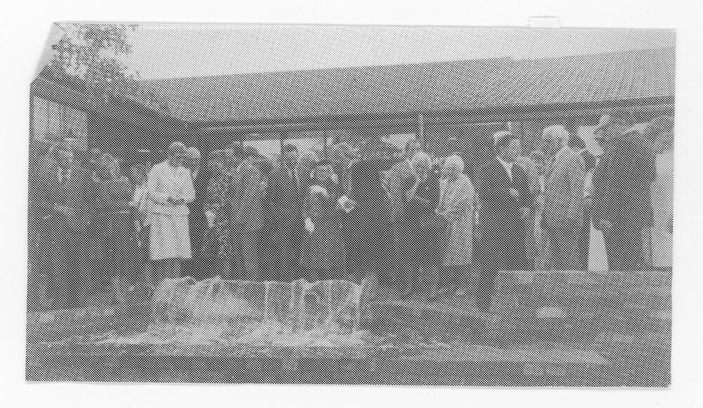 Group of unidentified people near a fountain in the [Central Courtyard, UNE]