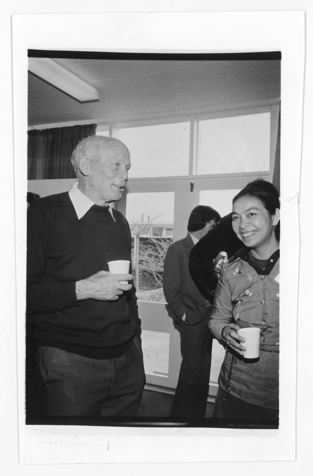 Two unidentified individuals at a gathering, UNE