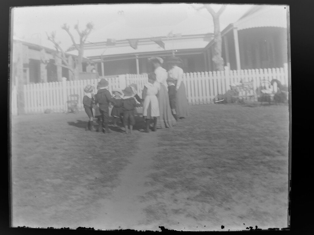 Children playing Ring a Ring o' Rosie