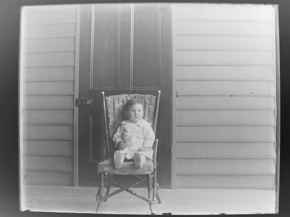 A boy sitting in a chair