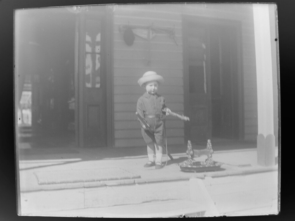 Boy playing on the front porch