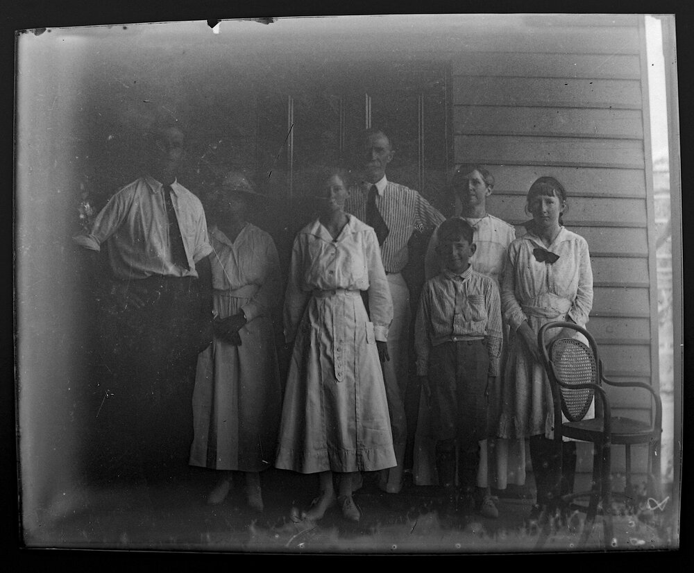 Group photo of two men, four women and a boy