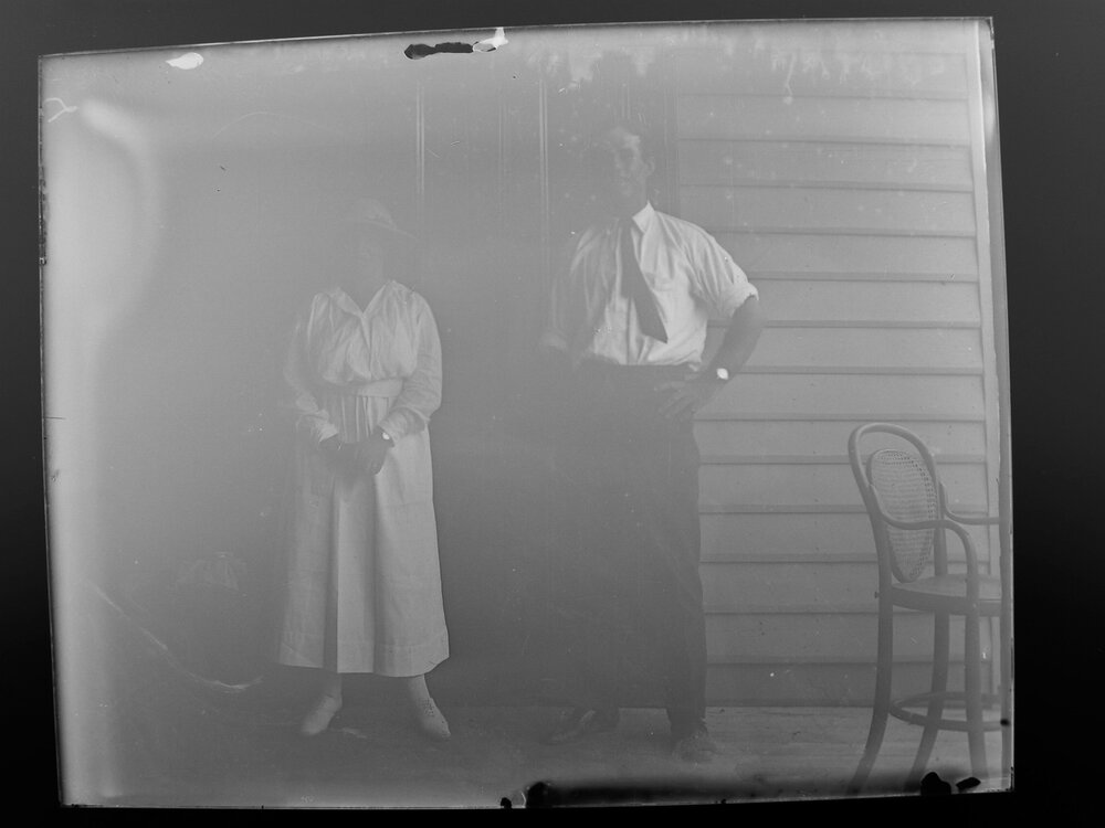 A woman in a hat and a man in a tie