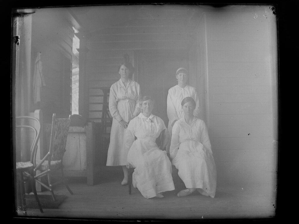 Posed group portrait of four women
