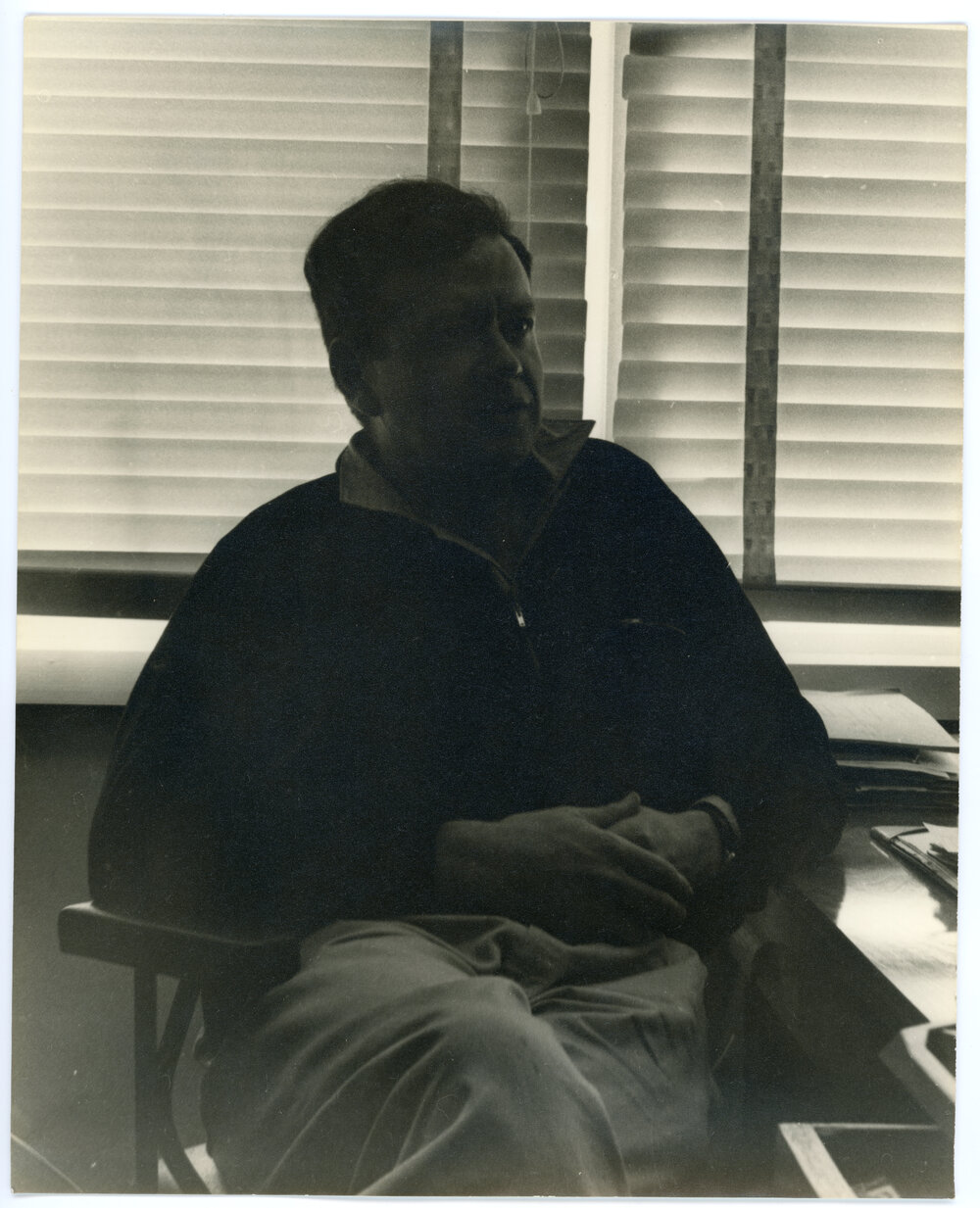 John Ryan seated at a desk