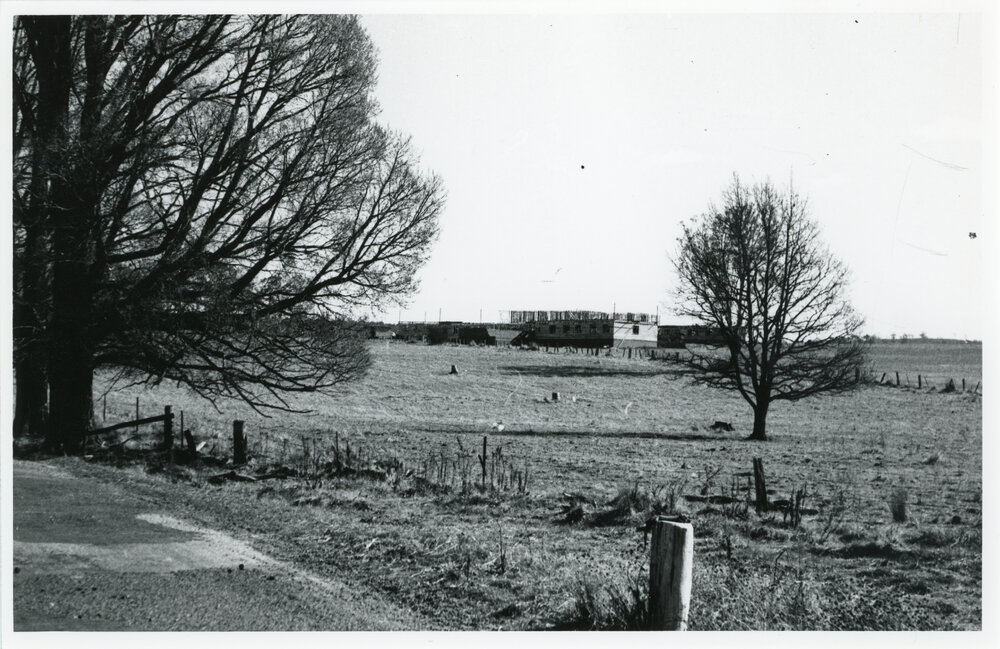 View towards Wright College construction site from the road, 1957