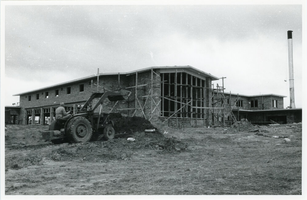 Wright College under construction with tractor, 1960