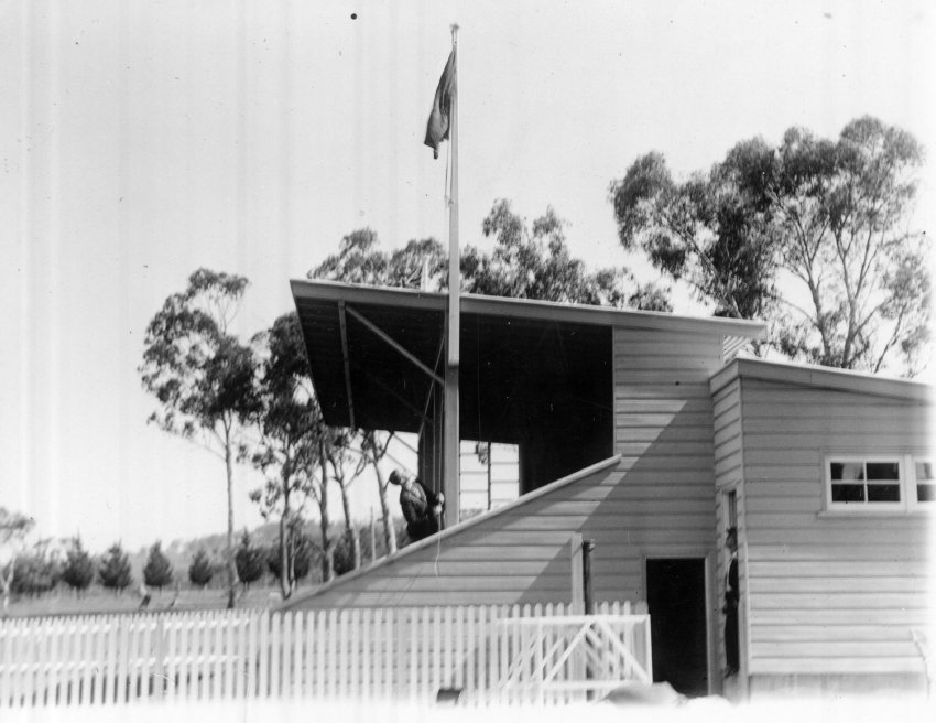 Armidale Teachers' College: Hoisting the flag at the Annual Athletics Carnival, Oxford Pavilion, 1935