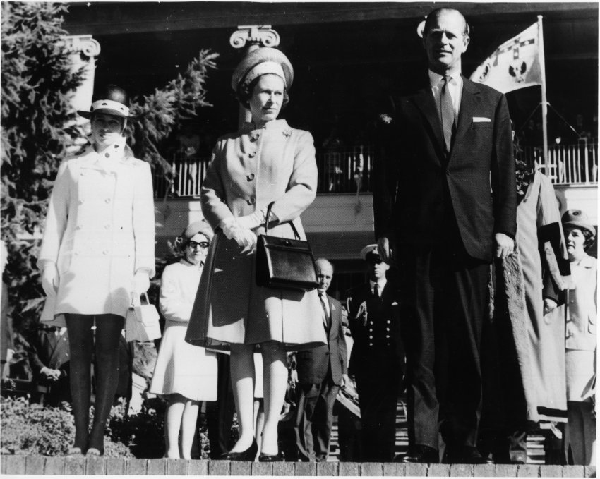 Queen Elizabeth, Prince Philip and Princess Anne stand in front of the College while attending a civic reception, 28 April 1970. 