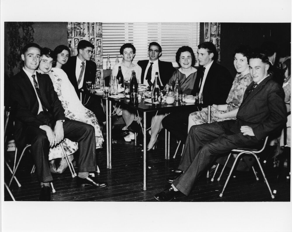 Wright College party, group seated at a table