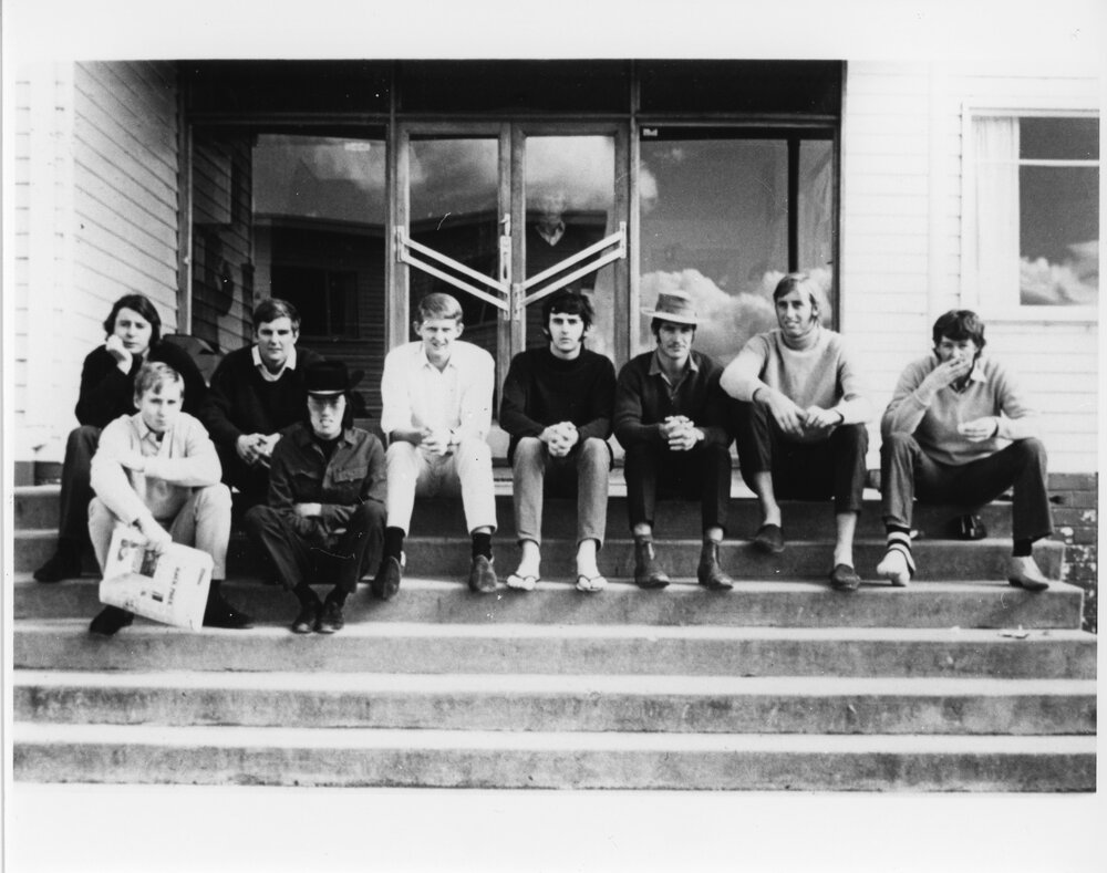 Wright College students sitting on outside steps
