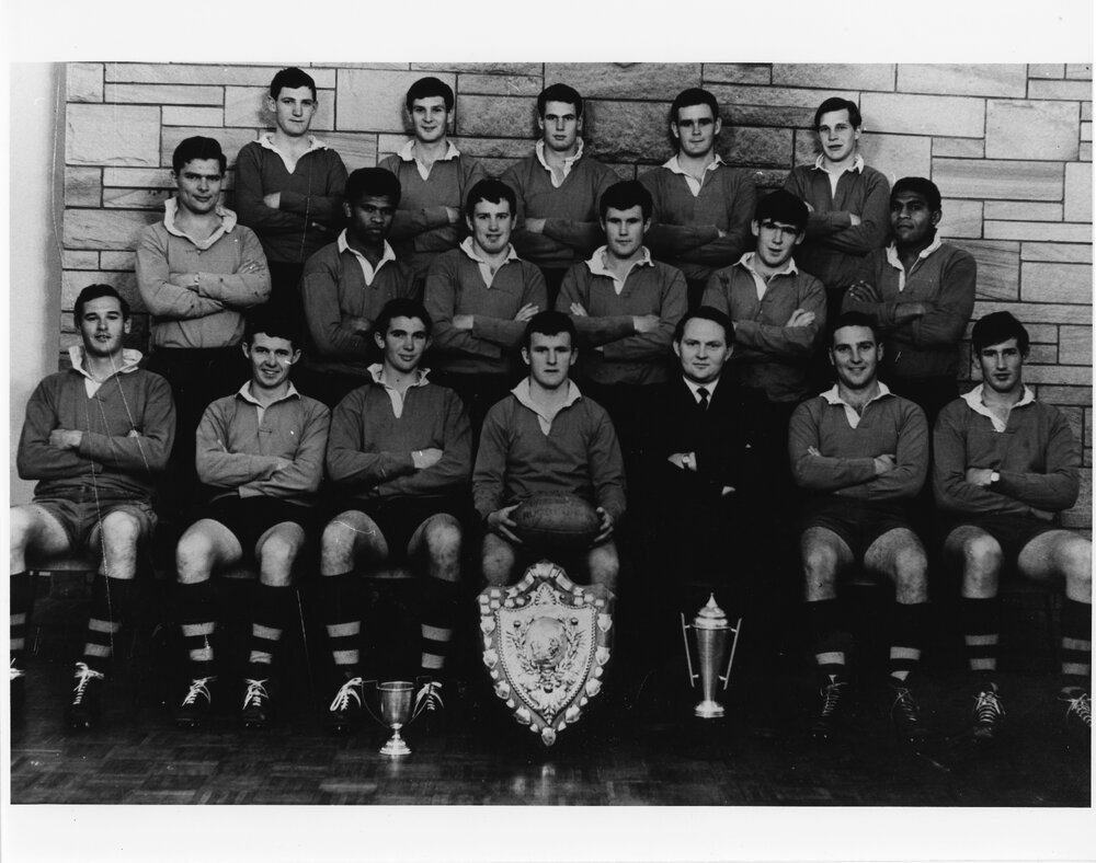 Wright College football team with shield
