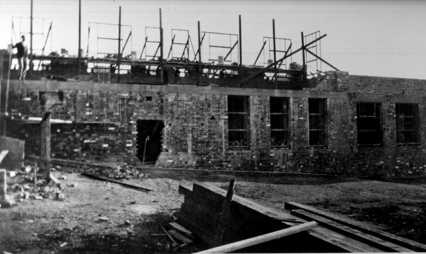 Armidale Teachers' College building under construction - window frames being inserted, 1928