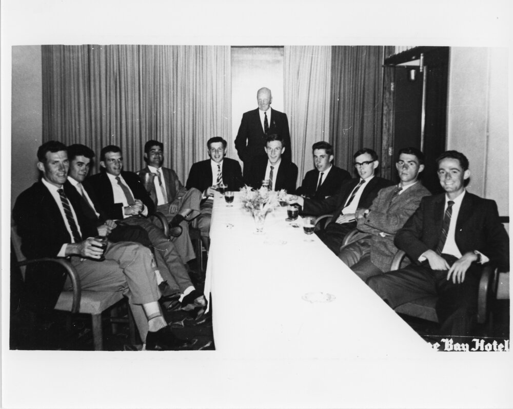 Wright College - Group of gentlemen around a table