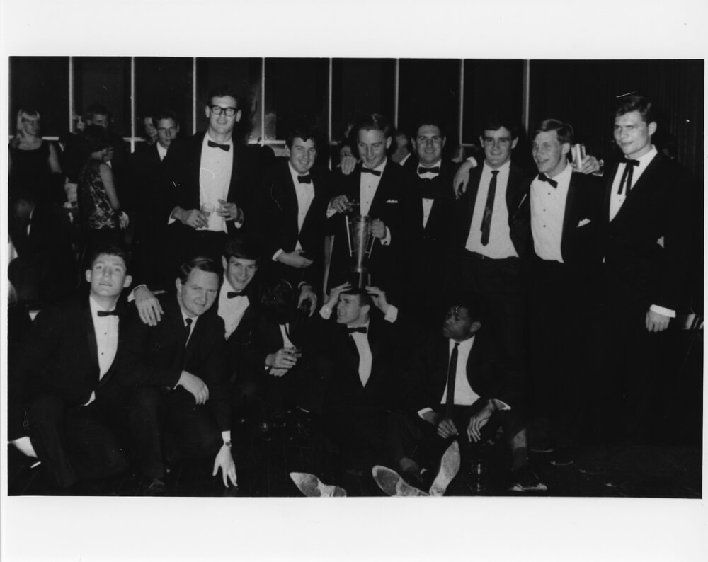 Wright College party group with trophy