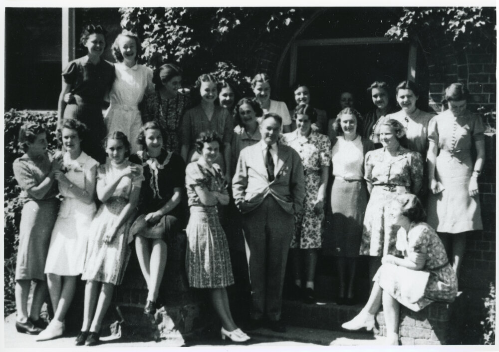 E.H. Booth with students