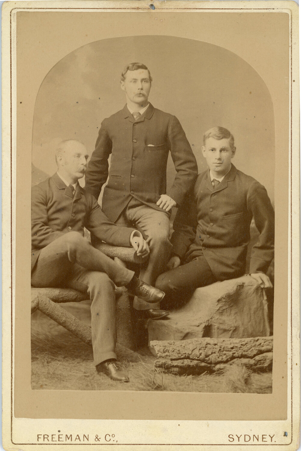 Three men (father and sons?)