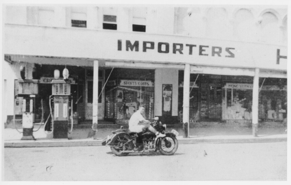 Trevor Jack on his motorbike out the front of Hong Yuen, Inverell, c1935