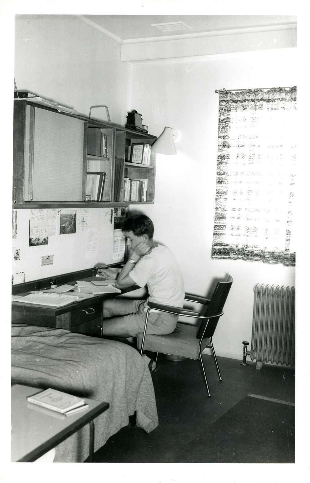 Wright College student studying in a dorm room