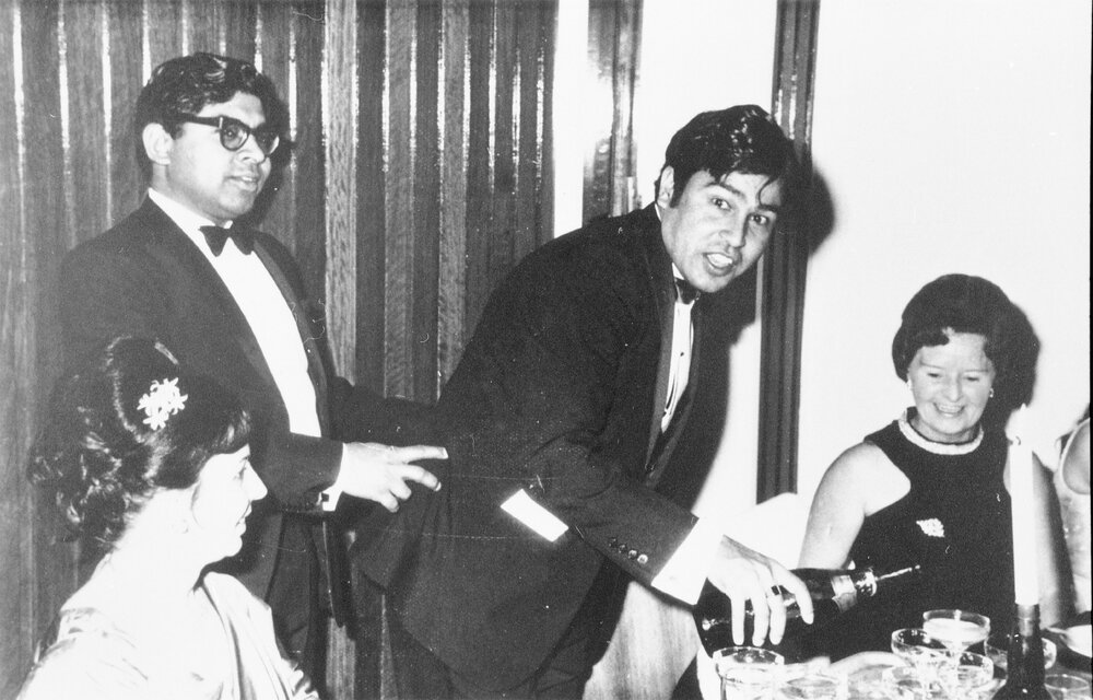 Pouring champagne at an unidentified Wright College event