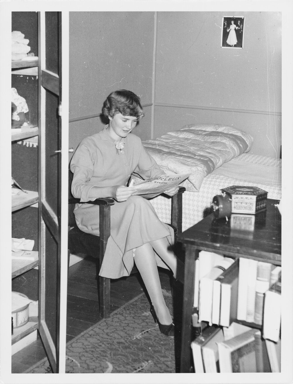 Student reading a Nucleus magazine in a dormitory