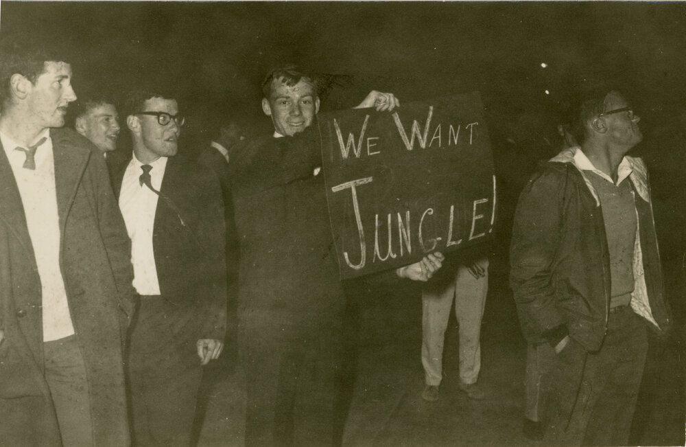 Wright College students holding a &ldquo;We Want Jungle!&rdquo; sign, 1964
