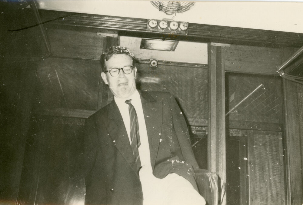 Man inside train carriage, [Wright College] 1964