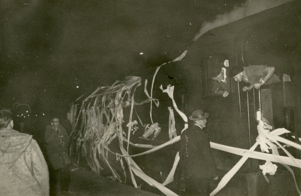 Wright College students with train draped in toilet paper, 1964