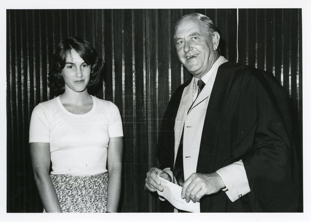 Miss Annette Mehaffey receiving an award from Mr Jim Pollard