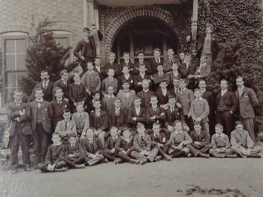 Group of pupils and staff outside the Armidale School