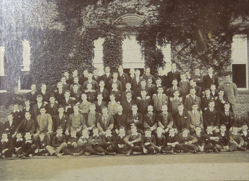 Group of pupils and staff outside the Armidale School