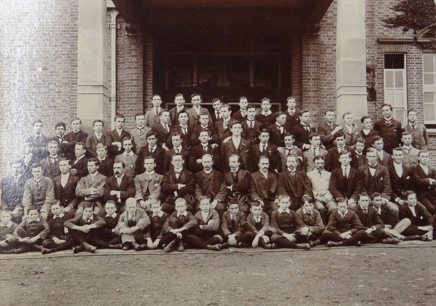 Group of pupils and staff outside the Armidale School