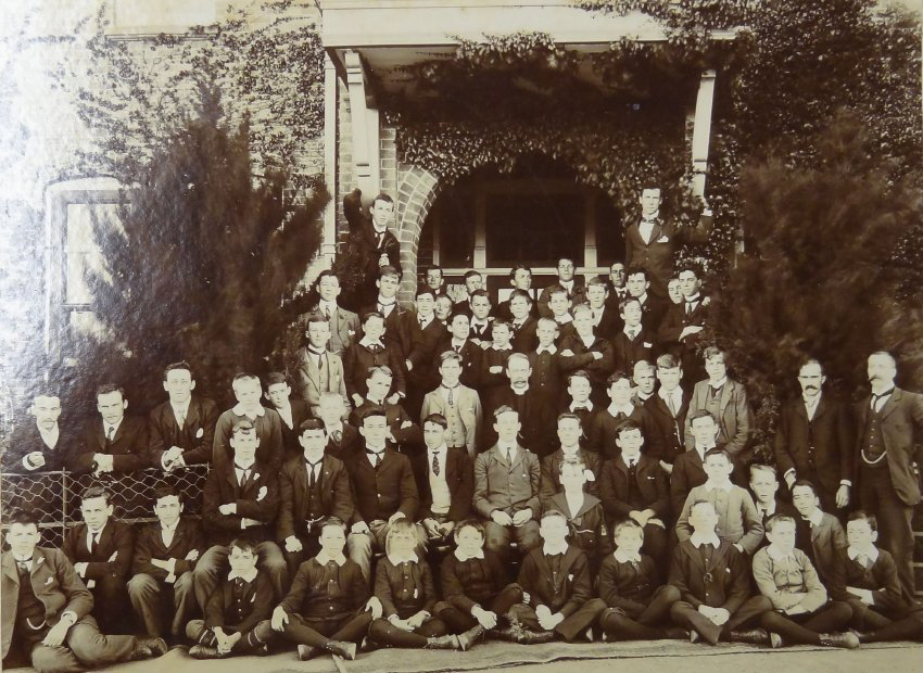 Group of pupils and staff outside the Armidale School
