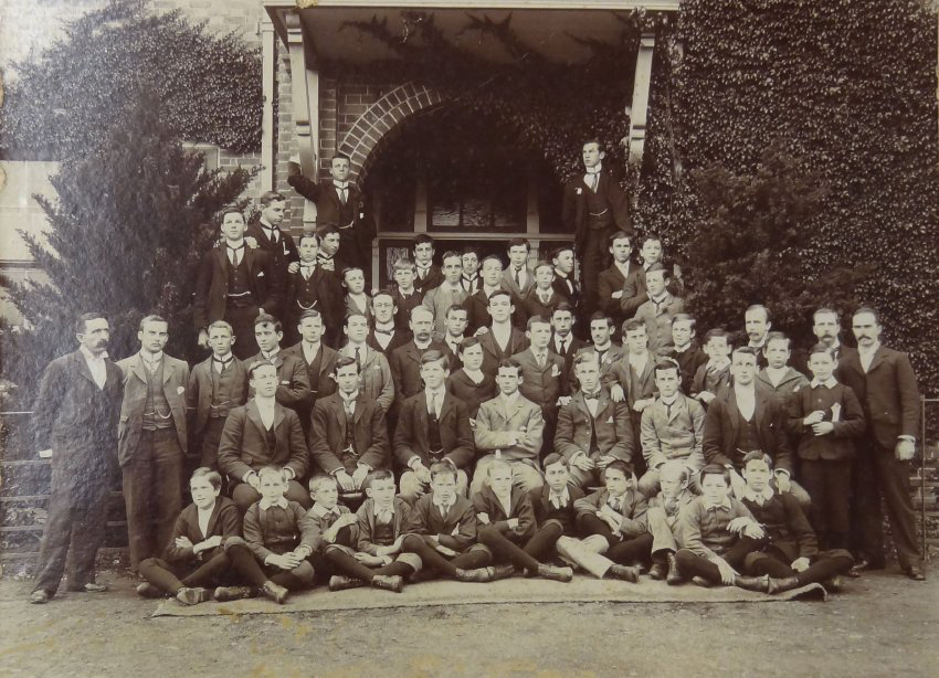 Group of pupils and staff outside the Armidale School