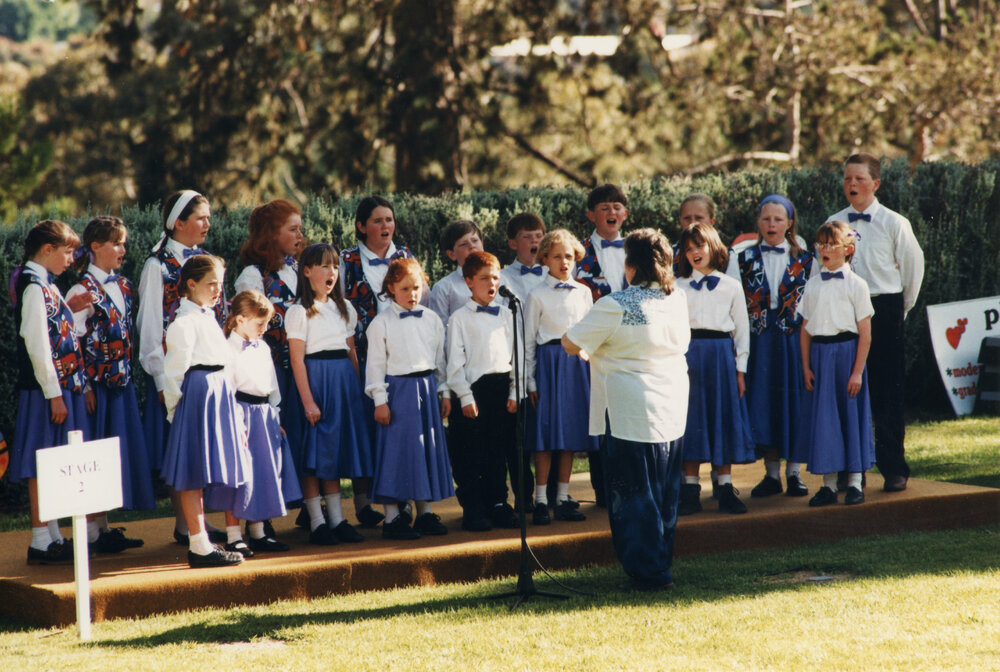 A choir performing at the UNE Celebration of Giving, 1995