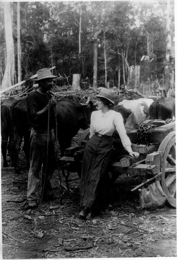Bullock team - Man and women posed with right and team.